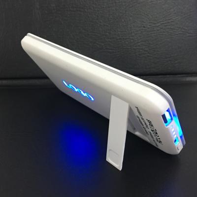 China New 4000mAh 5000mAh Stand Slim Portable Electronic Phone Wireless Power Bank With Led Light Up Logo for sale