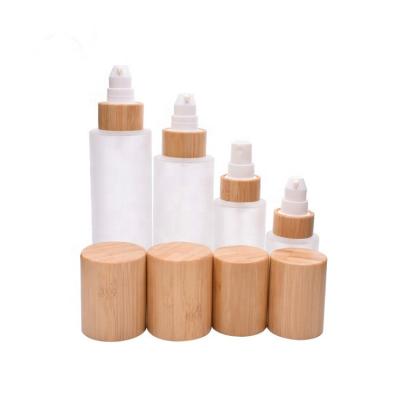 China 2020 Hot Selling Personal Care Cylinder Shape Emulsion Bamboo Pump Lotion Bottle Portable Frosted Glass Travel Spray Bottle for sale