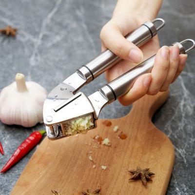 China Sustainable Garlic Press Stainless Steel Meat Grinder And Grinder With Rocker And Garlic Peeler for sale