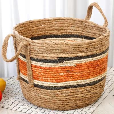 China Sustainable Wholesale round portable colored straw braid woven laundry basket for sale