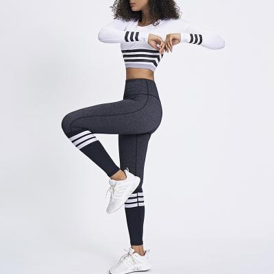 China Breathable Black And White Stripes Contrast Color Sports Fitness Suit Crop Top Gym Wear 2 Pcs Women Yoga Set for sale