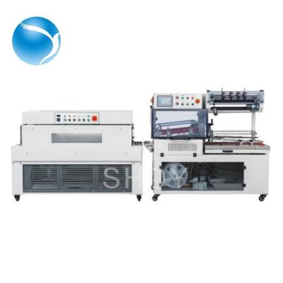 China Food Goods In Stock DYQL5545 L Automatic Bar Heat Tunnel US Sealing Cutting Shirnk Packing Machine for sale