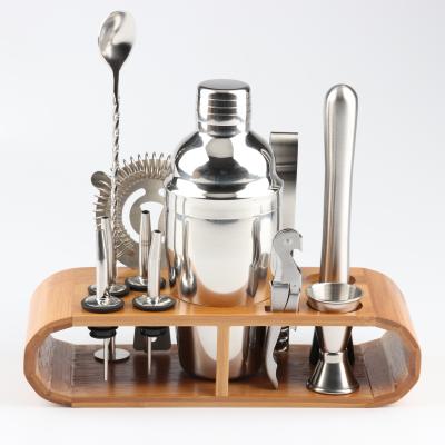 China Viable 11 Piece Metal Cocktail Shaker Set With Wooden Stand Bartender Set Professional Bar Tools for sale