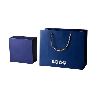 China Customized Recyclables Own Logo Two Sides Printing Gold foil hot stamping packaging shopping paper bags with handles for sale