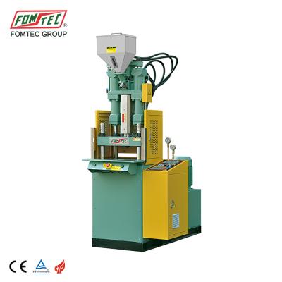 China FOMTEC VERTICAL Plastic Injection Machine For Making Sun Glass 2 Color Frame for sale