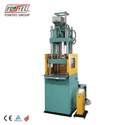 China VERTICAL FOMTEC Injection Molding Machine 1600 kN Standard Plastic Injection Machine Min Tabletop Machine for sale