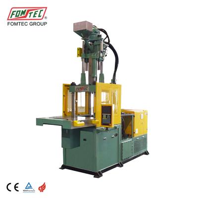 China 1200 kN VERTICALE single plastic table shuttle injection molding machine vertical sliding injection molding machine for sale