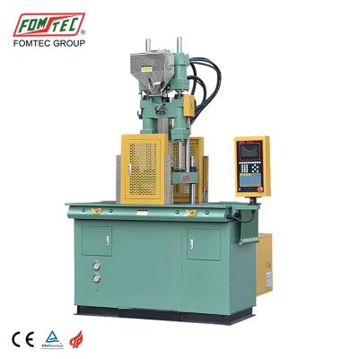 China VERTICAL plastic injection molding machine with 40TON sliding table for sale