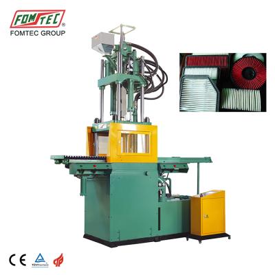 China VERTICAL 1600 kN double slip table plastic auto parts injection molding machine phone case vertical machine maker pallet making for sale