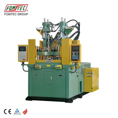 China FOMTEC VERTICAL vertical injection molding machine 1200 KN large insert parts injecting machine rotary table machine for sale