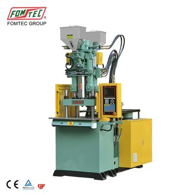 China FOMTEC VERTICAL 60TON TWO COLORS TOOTHBRUSH machine china machine manufacturer for sale