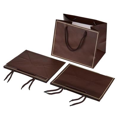 China Hot Stamping Foldable Paper Bag With Barbed Braided Handler for sale