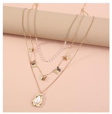 China Fashion Wholesale Fashion Jewelry Women Small Multi Layered Butterfly Necklace Gold Chain Necklace With Pearl Bead Pendant Necklace for sale