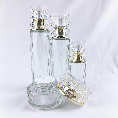 China 50ml 100ml Cosmetic empty glass jar with gold cap for sale