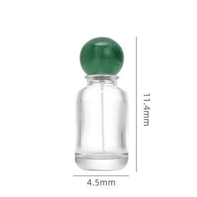 China Luxury Round Glass Perfume Bottle With Marble Lid Mountain Bottom Unique Perfume Bottle for sale