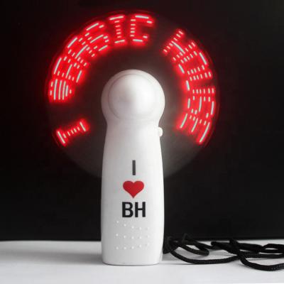 China Flashing With Your Customized Mini Handheld Led Flashing Words Message Battery Operated Custom Fan for sale