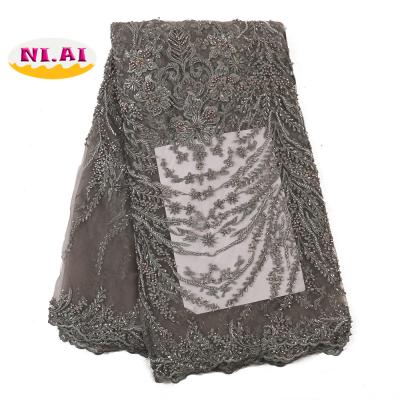 China French lace fabric 2020 embroidery lace fabric high quality nigerian handmade african beaded wedding lace fabric viable for sale