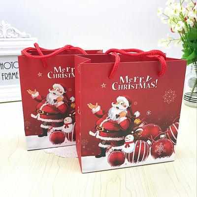 China Wholesale Recyclable Luxury Red Christmas Paper Bags Shopping Bag With PP Rope Handles for sale