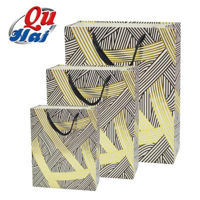 China Recycled Materials Gold Paper Shopping Bag Logo Printed Luxury Gift Bag Custom Made For Christmas Promotion for sale