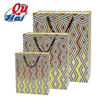 China 2021 Materials New Design Luxury Recycled Gold Foil Paper Bag Recycle Shopping Tote Bag Custom Size Logo for sale