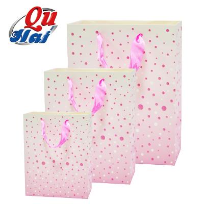 China Recycled Materials Wholesale Custom Paper Gift Bag Printed With Your Own Logo Luxury Pink Craft Shopping Paper Suitcase With Handles for sale