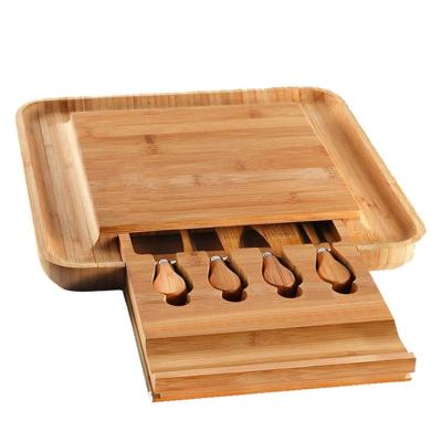 China Wedding Delicatessen Totally Natural Solid Custom Compartment Bamboo Cheese Board With Cutlery Set for sale