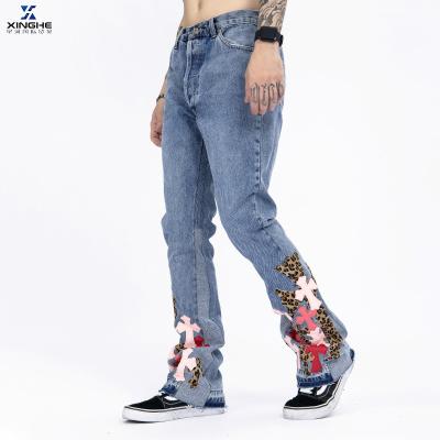 China QUICK DRY brand new fashionable high street light blue cross embroidery flared pants casual jeans for sale