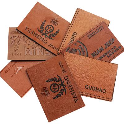 China Washable Custom Clothes Personalized Leather Labels For Handmade Items With Button Fabrics for sale