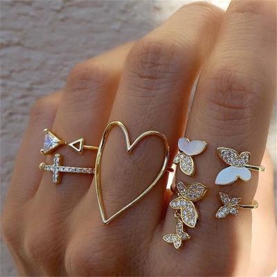 China Vintage Triangle Cross Love Hollowed Out Butterfly Ring Full Drill Oil Five Piece Jewelry Ring Set for sale