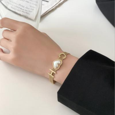 China CLASSIQUE 2021 New Design Heart Women Gold Planted Letter Bracelet In Luxury Simple Titanium Steel for sale