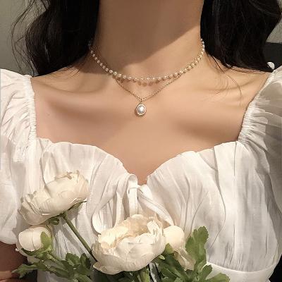 China New FASHIONABLE designs pearl jewelry alloy chain choker white pearl pendant double layer necklace for girl for sale