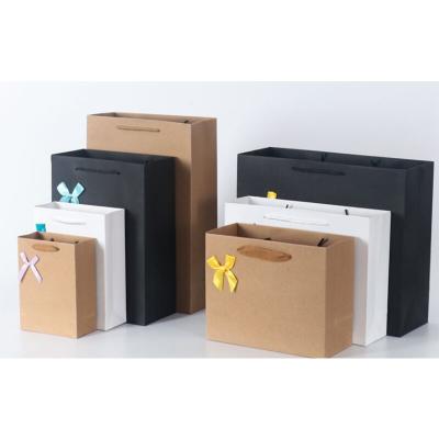 China New Design Recyclable Customize Foldable Stand Up Storage Kraft Paper Bag With Ribbon Closure for sale