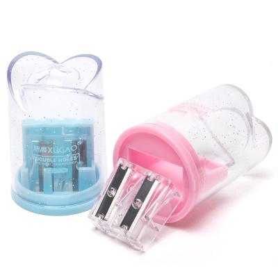 China 65Mn/PS patent transparent light pink pencil sharpener baby kid manual cute floral hole high quality plastic safe double flower material for sale