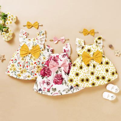 China 2021 Summers New Baby Flower Print Flower Dress Breathable Cotton Pink Yellow Bow Sleeveless Sun Dress With Headband Baby Clothing for sale