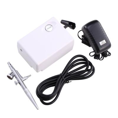 China Skin Rejuvenation Mini Air Compressor Set Gravity Supply Airbrush Kit for Art Painting Tattoo Air Brush Nail Tool Kit for sale