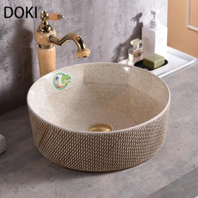 China YL3413-19 Modern Bathroom Khaki Yellow Lines Sculpting Basin Round Above Counter Mount Designed Ceramic Toilet Hand Wash Art Basin for sale