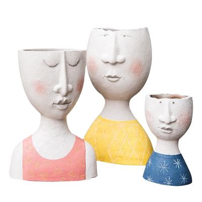 China Creative Modern Contemporary Cartoon Portrait Resin Vase For Home Decoration Vase Gifts for sale