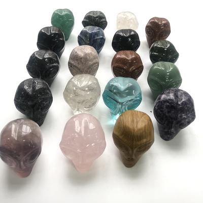 China Europe Crystal Folk Crafts Art Wholesale Natural Hand Carved Quartz Crystal Alien Skulls For Decoration for sale