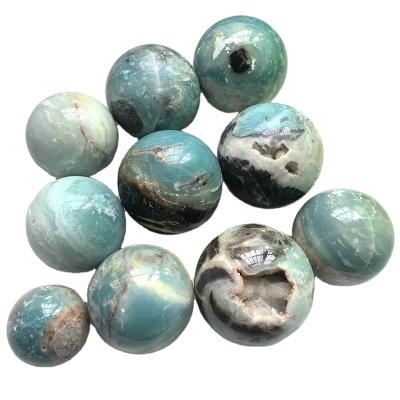 China Natural Polished Rock Crystal Carving Crafts from Europe Crystal Calcite Sphere Light Color for sale