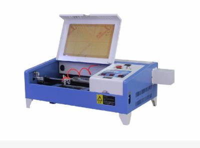 China Ldc Multi Function Screen DSP Control Repeatability 0.01mm Rotary Fixture Auto Lifting Platform 40W CO2 Laser Engraving for sale