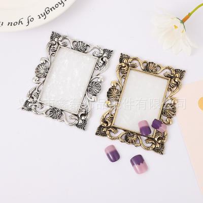 China Easy Apply Wholesale Customizable Retro Alloy Frame Marble Halo Dyed Resin Nail Display Board Color Palette for sale