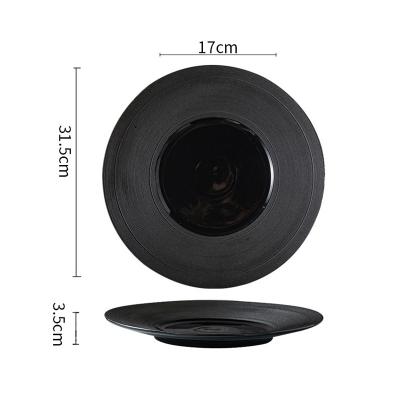 China Creative Black Round Wes Hotel Flying Saucer Straw Hat Nest Dish Viable Commercial Ceramic Dish Home Steak Tableware for sale