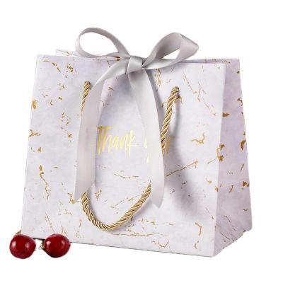 China Elegant Luxury Printed Marble Paper Christmas Gift Shopping Paper Bag Hand Made/Blackberry Workmanship with Custom Logo with Ribbon Bow for sale