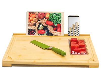 China Viable bamboo cutting board with food containers and phone holder for sale