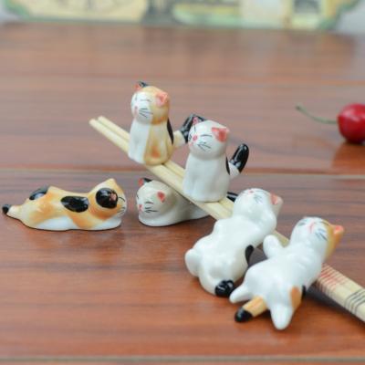 China Japanese Style Microwavable Custom Ceramic Porcelain Table Accessories Kitchenware Cute Cat Shaped Chopsticks Rest for sale