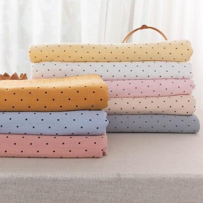 China Breathable Soft Gauze Printed 100% Polka Dot Cotton Muslin Double Gauze Fabric for sale