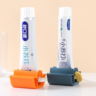 China Sustainable Tube Toothpaste Squeezer Toothpaste Seat Rolling Rack for sale