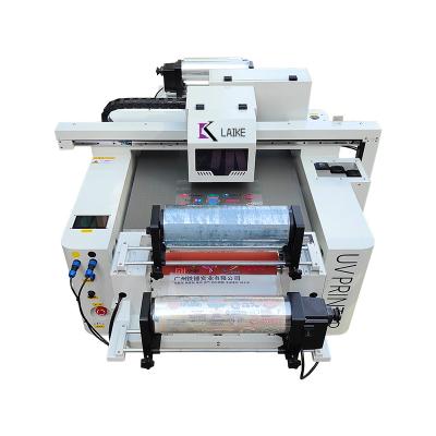 China Garment Shops Label Sticker UV 6090 model Dtf Printer with laminator for glass transfer stickers for glass cups for sale