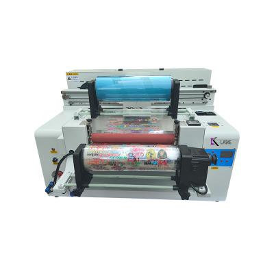 China Garment Shops Heat Transfer Machine UV 6050 model DTF PET AB Film Printer label sticker printing with XP600 for sale