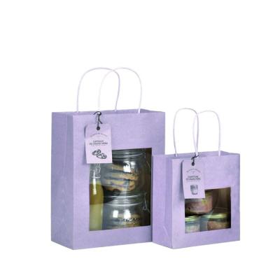 China Recyclable New Design Custom Kraft Paper Gift Bag With PVC Window And Handles for sale